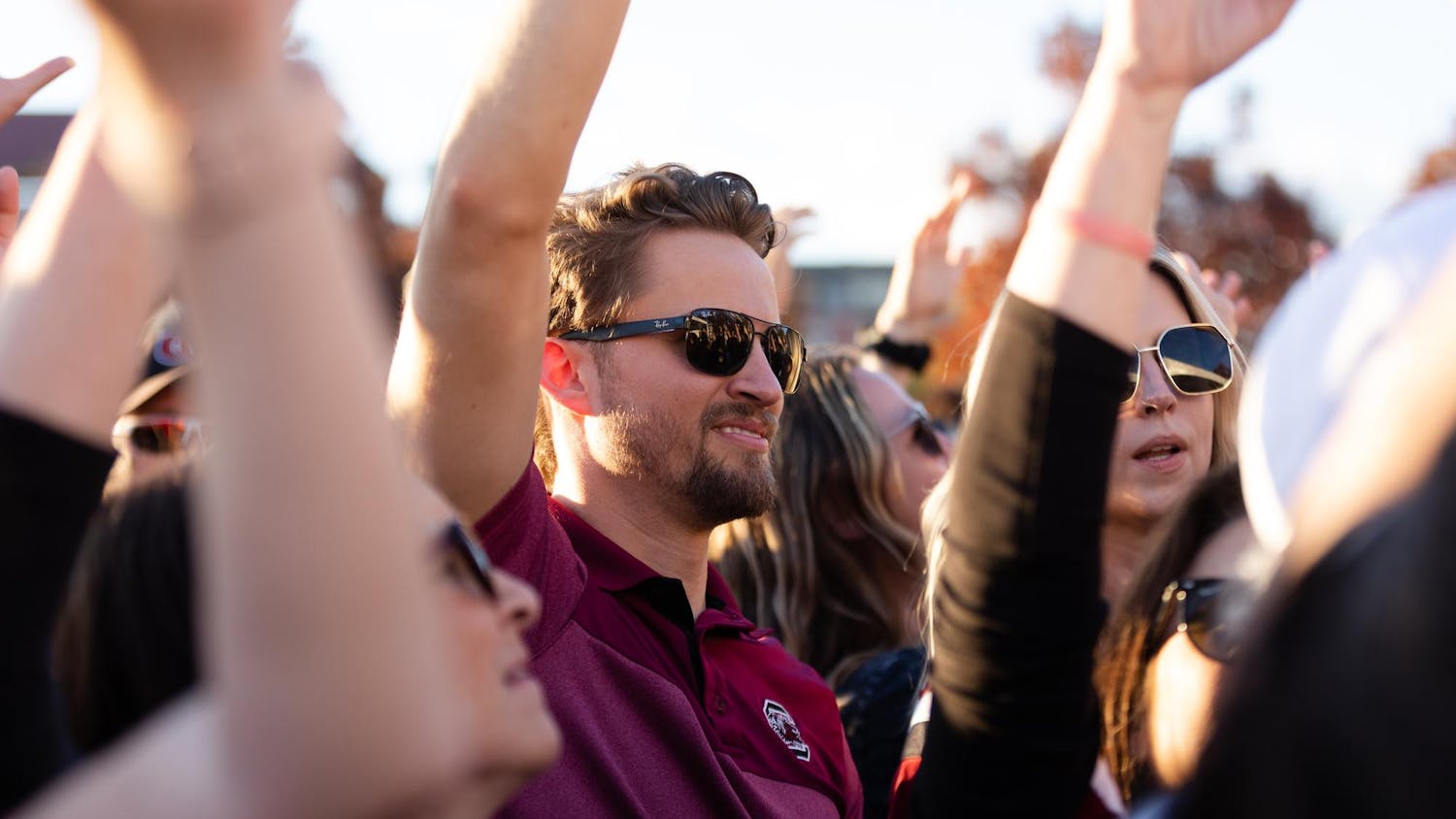 A fan moves his hands to the music while at the pre-game Darude concert in Gamecock Park. The Gamecocks went on to defeat the Wildcats 17-14.