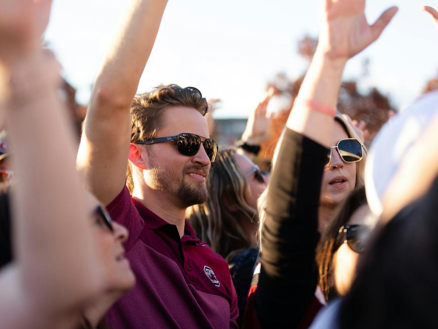 A fan moves his hands to the music while at the pre-game Darude concert in Gamecock Park. The Gamecocks went on to defeat the Wildcats 17-14.