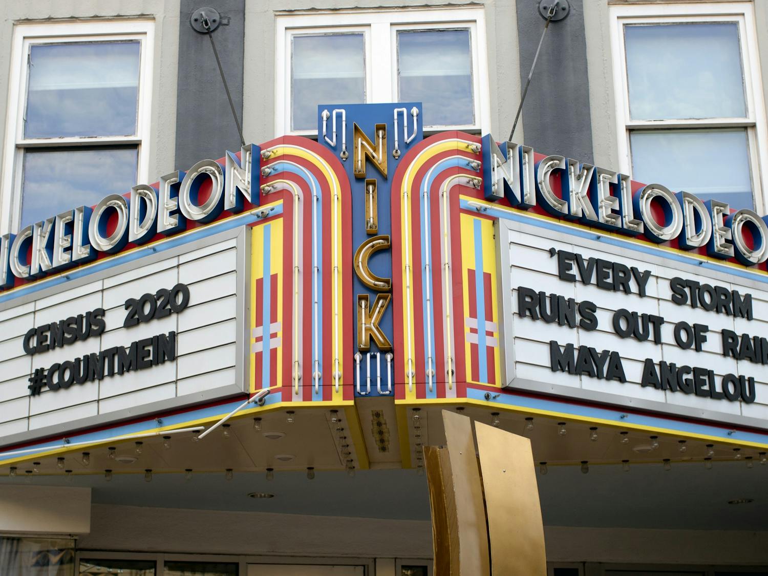 The marquee on the exterior of The Nickelodeon displays a hashtag referring to the census and a Maya Angelou quote. While the theater has canceled all in-person screenings due to COVID-19, it continues to offer virtual screening rooms.