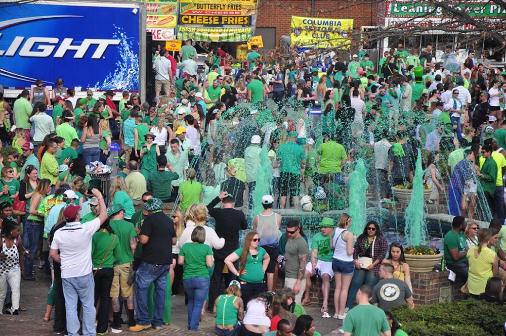 	The skies may have been a bit gray Saturday, but Five Points was nothing but green, as thousands of people turned out – and up – for St. Patrick’s Day. 

	Partygoers decked out in green hats, beads and boots packed the streets and queued up to get into the bars to celebrate the Irish for the 32nd annual St. Pat’s in Five Points. Lines stretched out of the doors, onto the sidewalks and into the streets, which had been blocked off for the festivities. 