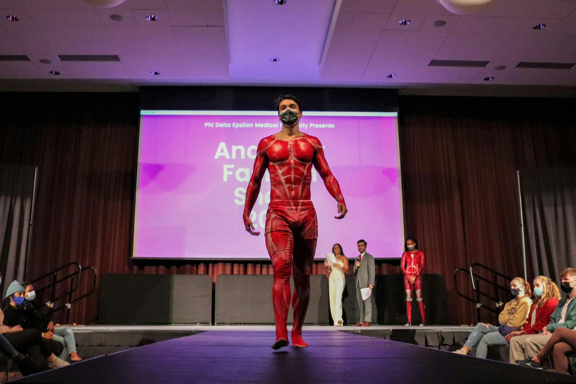 FILE— A model, painted with the muscular system walks the runway at the Phi Delta Epsilon's annual Anatomy Fashion Show on Nov. 9, 2021. This annual event combines medical education with art to fundraise for the Children's Miracle Network.&nbsp;