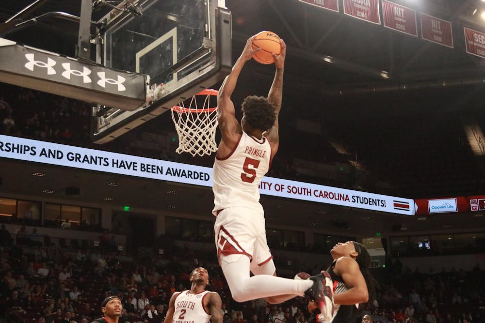 <p>Graduate forward Nick Pringle catches an alley-oop and dunks the basketball during South Carolina's game against Georgia on March 4, 2025, at Colonial Life Arena. Pringle played for just over 24 minutes and scored 11 points.</p>