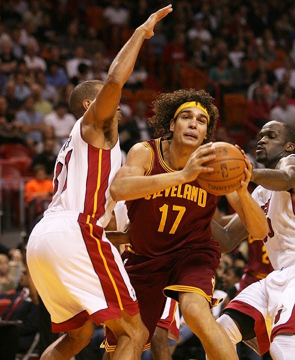 The Cleveland Cavaliers' Anderson Varejao (17) goes to the basket against Shane Battier, left, and Joel Anthony of the Miami Heat during the first quarter at the AmericanAirlines Arena in Miami, Florida, on Tuesday, January 24, 2012. Miami topped Cleveland, 92-85. (David Santiago/Miami Herald/MCT)