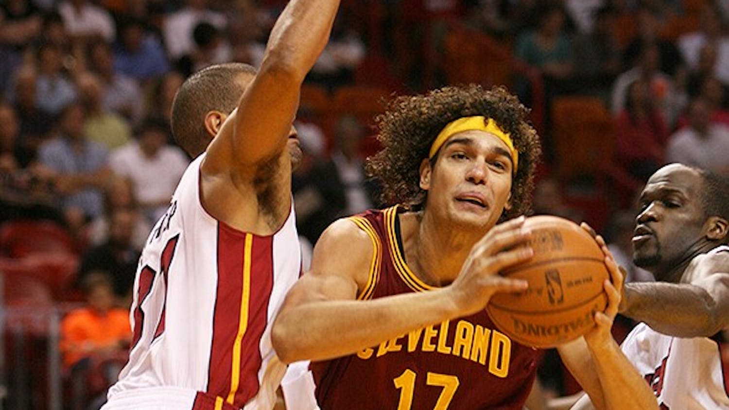 The Cleveland Cavaliers' Anderson Varejao (17) goes to the basket against Shane Battier, left, and Joel Anthony of the Miami Heat during the first quarter at the AmericanAirlines Arena in Miami, Florida, on Tuesday, January 24, 2012. Miami topped Cleveland, 92-85. (David Santiago/Miami Herald/MCT)