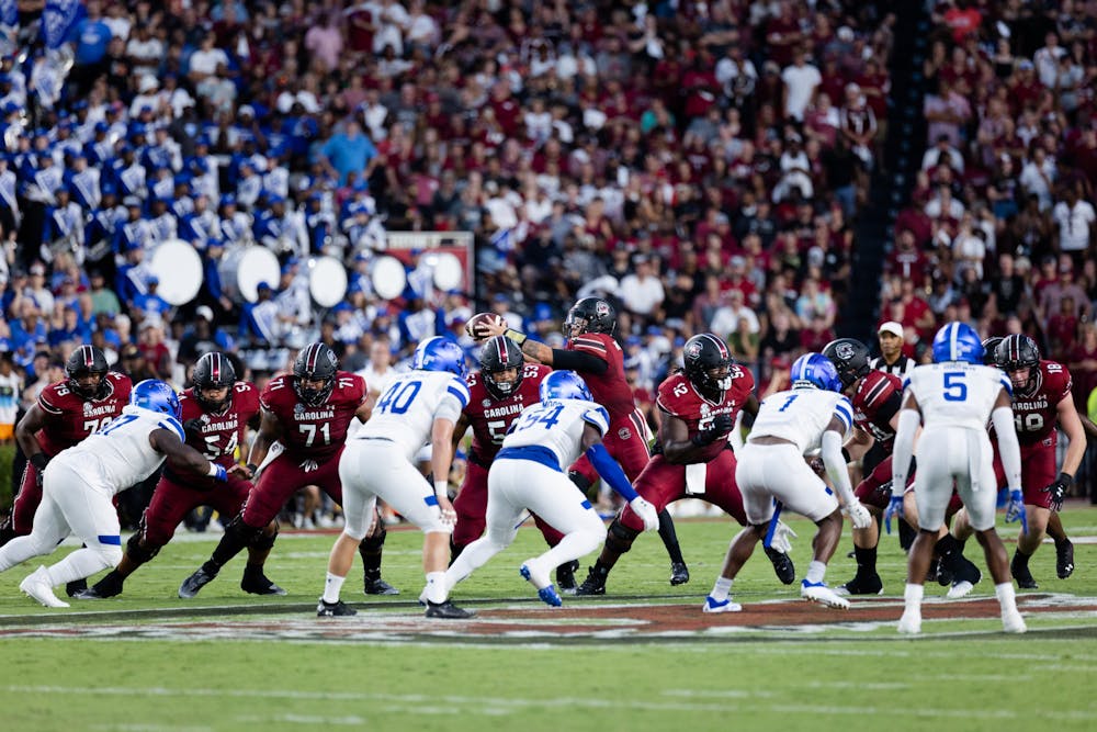 <p>FILE — Junior quarterback Spencer Rattler passes off the ball during the South Carolina and Georgia State game in Columbia, S.C., on Sept. 3, 2022. The Gamecocks won 35-14 against the Panthers.</p>