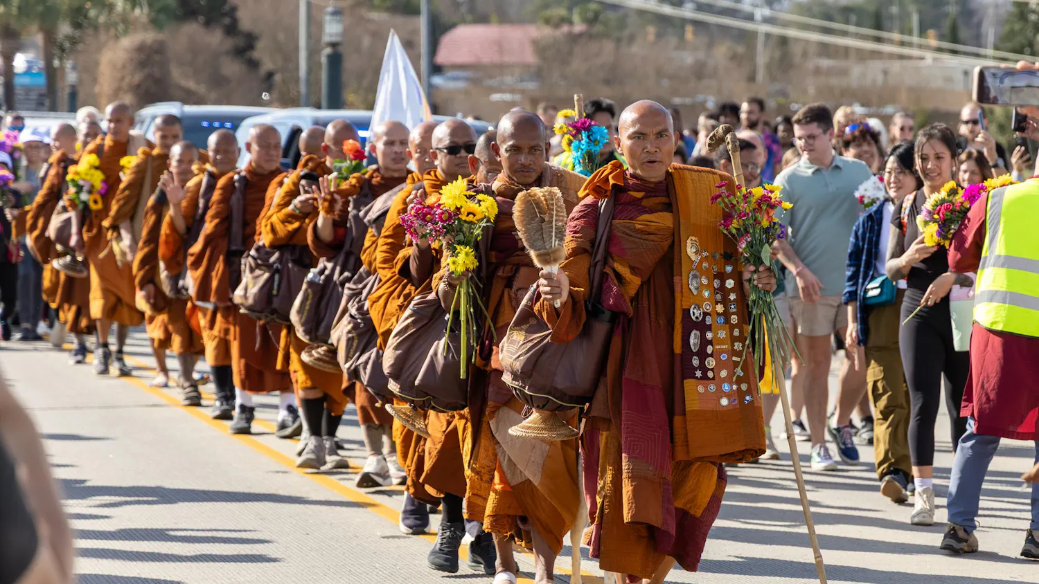 A group of Buddhist monks walks down the Gervais Street bridge during the Walk for Peace in Columbia, South Carolina, on Jan. 10, 2026. The monks began their journey in October 2025 in Fort Worth, Texas, and will conclude in Washington, D.C.