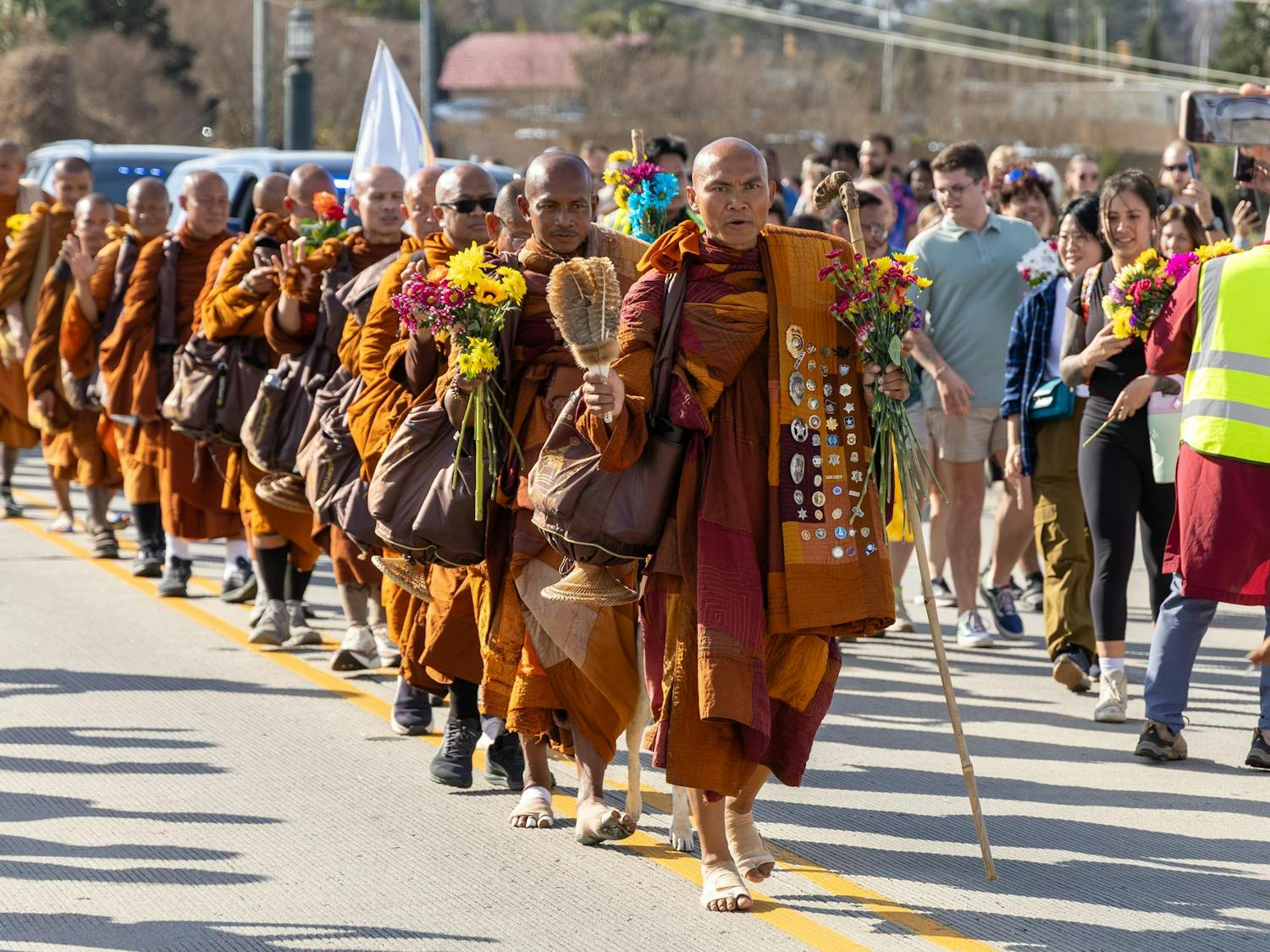 A group of Buddhist monks walks down the Gervais Street bridge during the Walk for Peace in Columbia, South Carolina, on Jan. 10, 2026. The monks began their journey in October 2025 in Fort Worth, Texas, and will conclude in Washington, D.C.