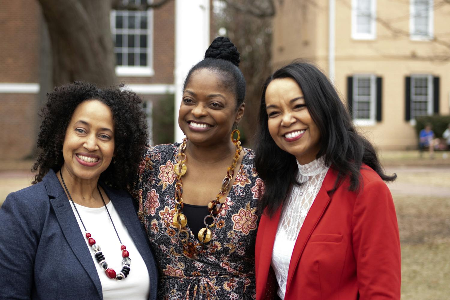 Three 鶹С򽴫ý alumnae and interviews in the student documentary, "The Backbone," pose for a photo at the Horseshoe on Feb. 10, 2023. The Office of Diversity, Equity and Inclusion revealed 18 new bricks in honor of them women that created the film.&nbsp;