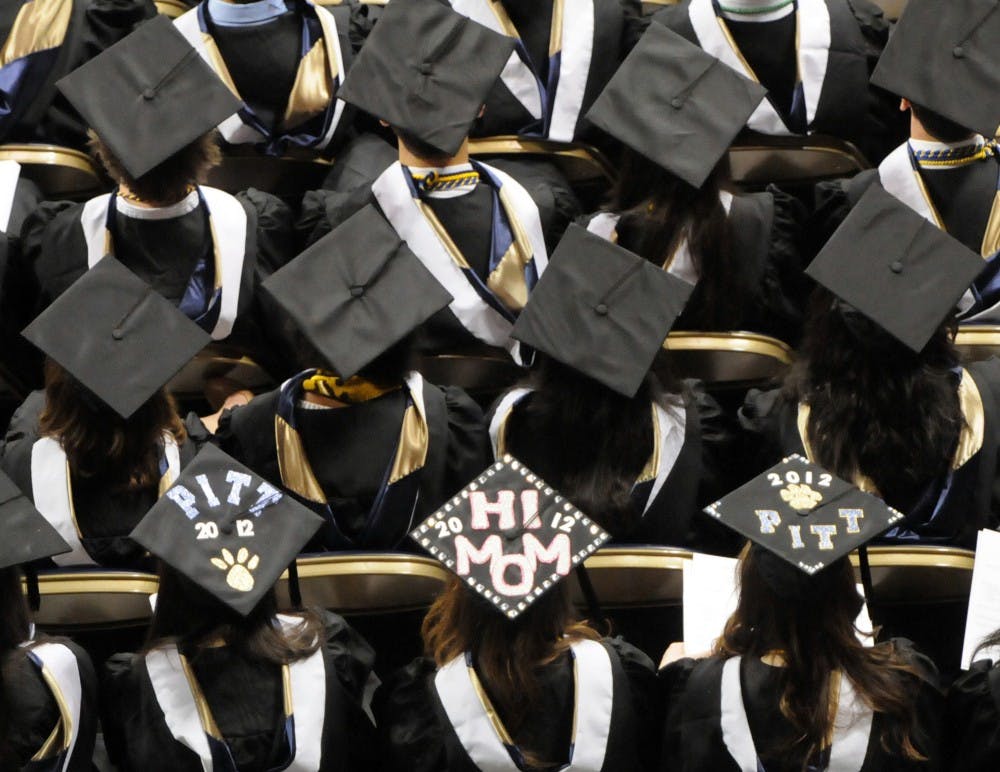 According to a new survey, nearly half of parents who haven't paid off their own student loans have saved at least $5,000 toward college costs for each of their children. (Bob Donaldson/Pittsburgh Post-Gazette/TNS) 