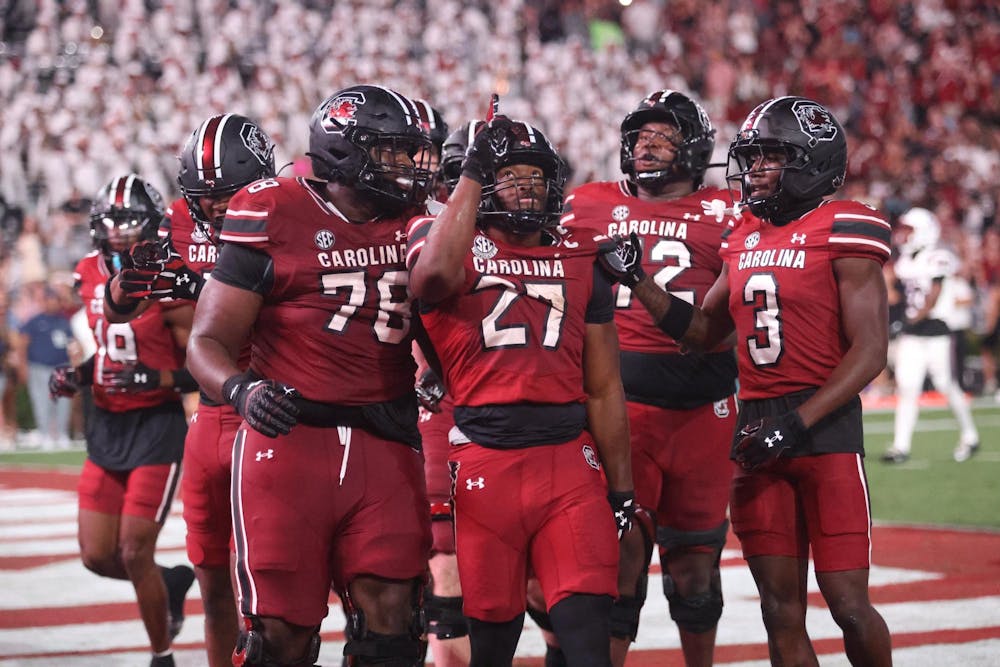 <p>Graduate running back Oscar Adaway III points towards the sky after scoring a touchdown during the game against SC State on Sept. 6, 2025. Adaway III contributed 6 points to the Gamecocks 38-10 victory over the Bulldogs.</p>