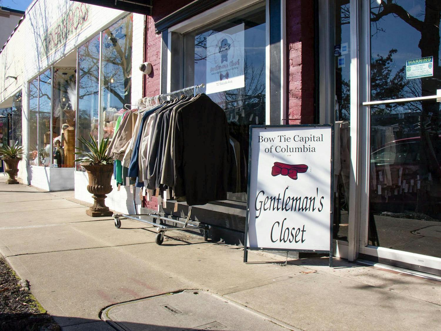 A sign outside of the Gentleman’s Closet reads "Bow Tie Capital of Columbia" on Jan. 30, 2024. The shop, located on Saluda Avenue in Five Points, is one of the few men’s consignment stores in Columbia, South Carolina.