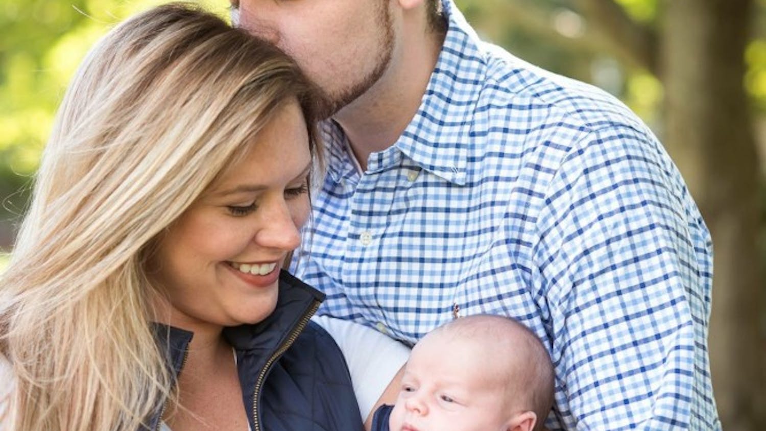 Sarah Thompson and her boyfriend Chris Maggiacomo hold their newborn son, Isaiah.