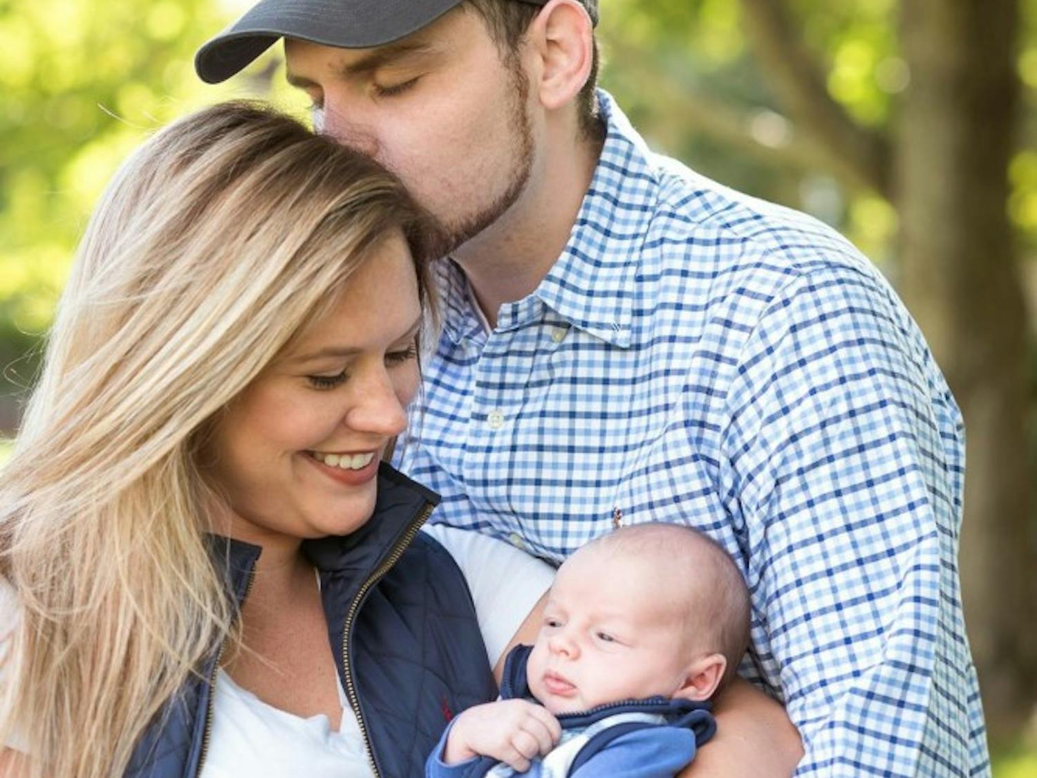 Sarah Thompson and her boyfriend Chris Maggiacomo hold their newborn son, Isaiah.