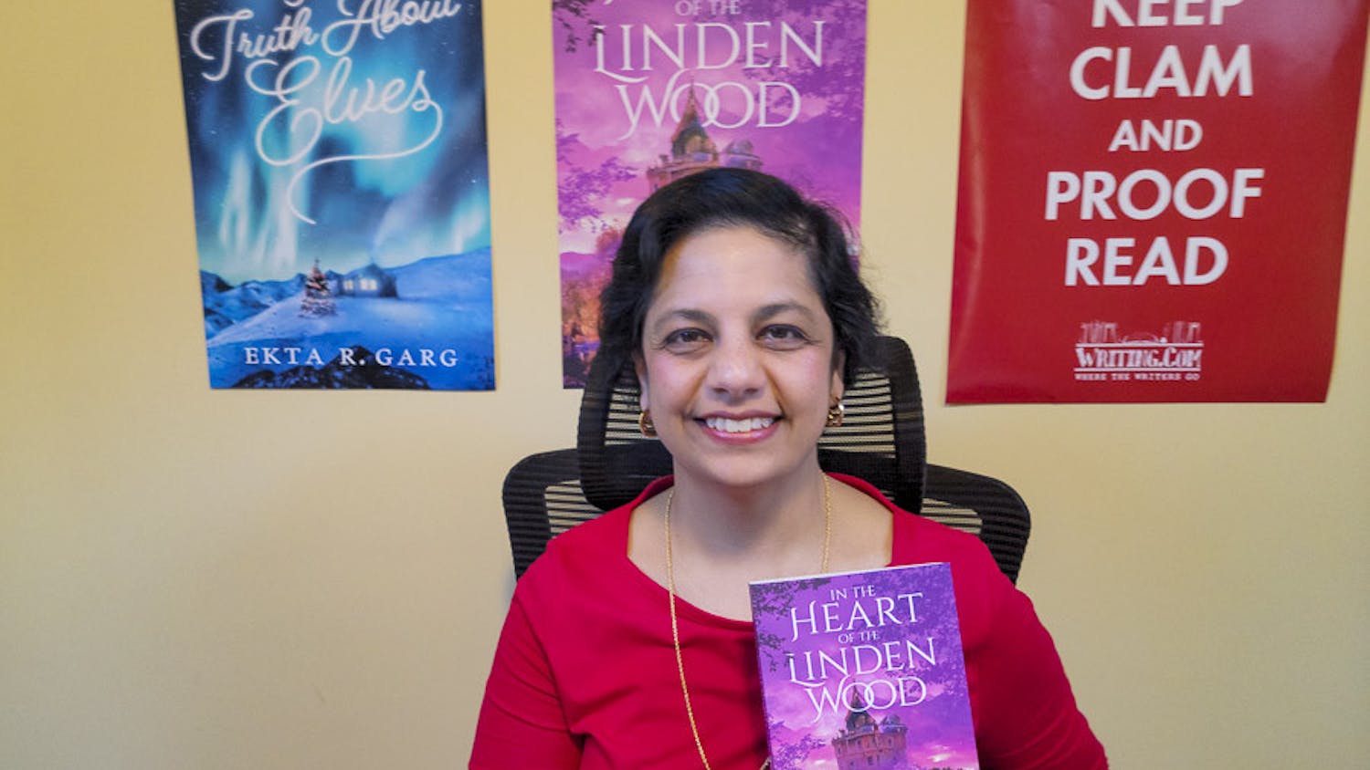 Ekta Garg poses in her office with her new book, "In the Heart of the Linden Wood," on Feb. 11, 2023. This is the second book that the USC alumna has published.