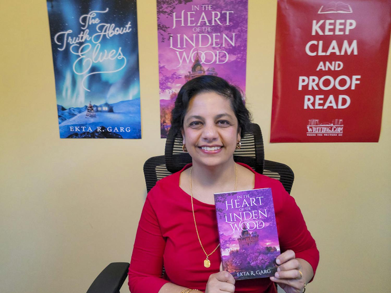 Ekta Garg poses in her office with her new book, "In the Heart of the Linden Wood," on Feb. 11, 2023. This is the second book that the USC alumna has published.