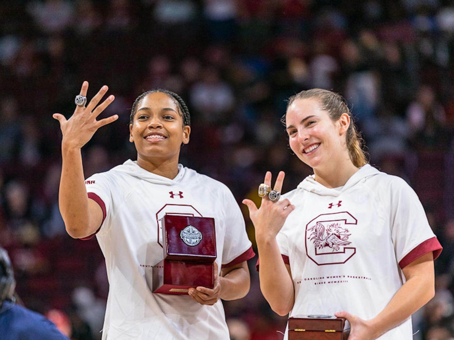 Senior guards Zia Cooke (left) and Olivia Thompson (right) smile during the ring ceremony. South Carolina played East Tennessee State on Nov. 7, 2022 and won 101-31.