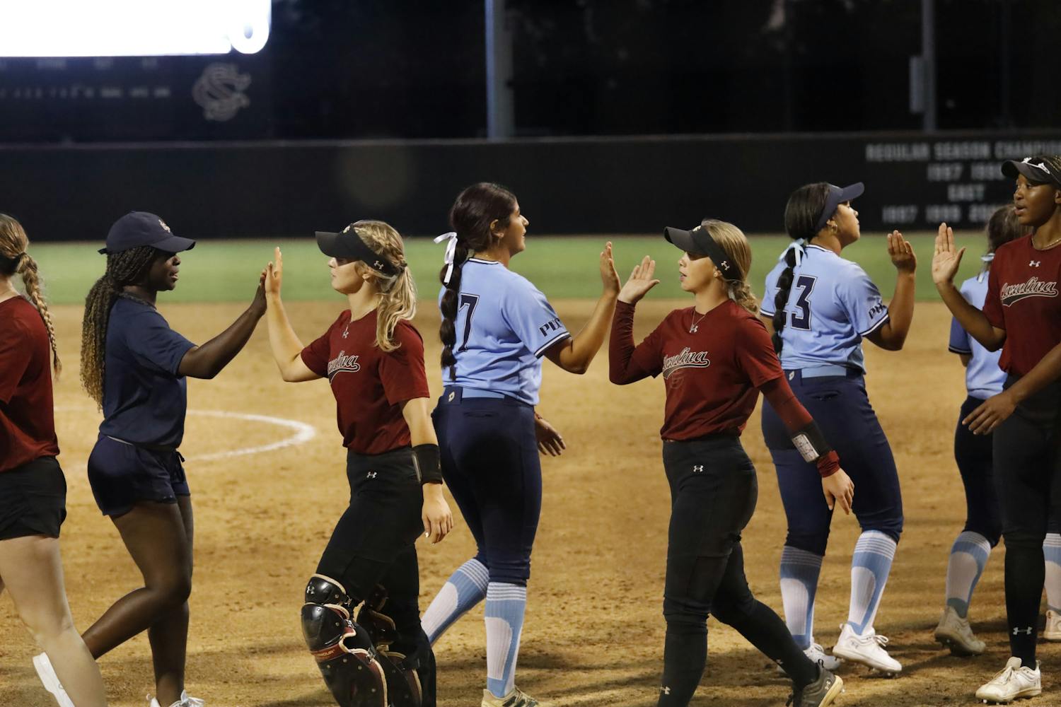 The Gamecock softball team high-fives members of 鶹С򽴫ý Beaufort's team after the two squared off in an exhibition at Beckham Field on Oct. 7, 2023. The 3-0 win over 鶹С򽴫ý Beaufort was South Carolina's second of the day following a 14-0 win over Wofford.