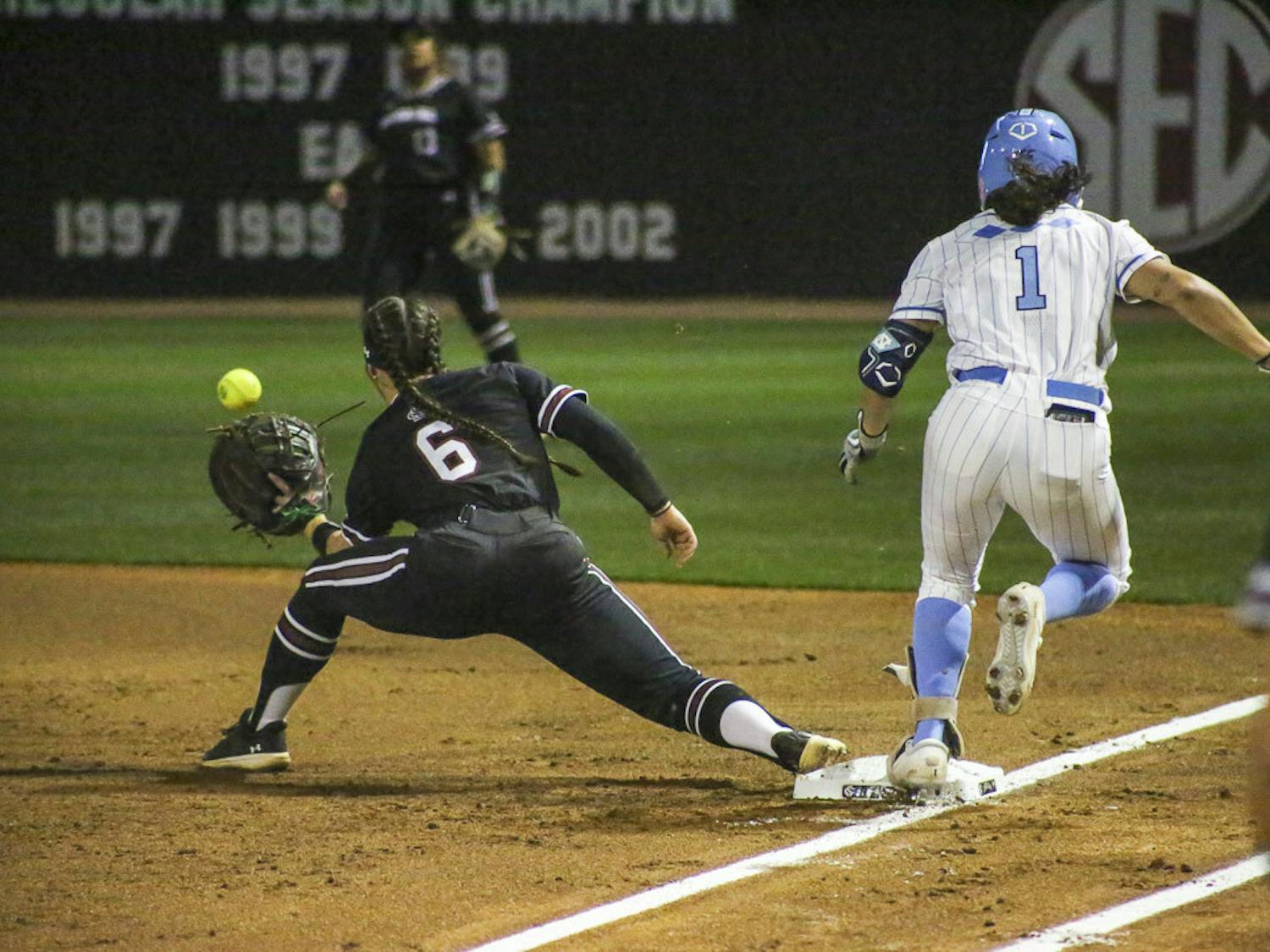 Fifth-year catcher and infielder Jordan Fabian (left) attempts to force out fifth-year first baseman Kiersten Licea (right) during the matchup between South Carolina and North Carolina at Beckham Field on March 1, 2023. The Gamecocks beat the Tar Heels 9-1.&nbsp;