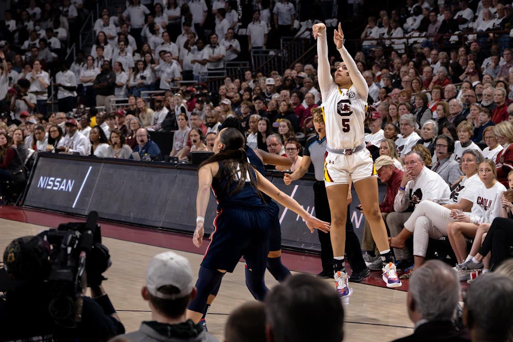 <p>Freshman guard Tessa Johnson attempts a 3-point shot during the Gamecocks' 83-65 victory over the Huskies on Feb. 11, 2024. Johnson scored 9 points for the Gamecocks during her 15 minutes playing at Colonial Life Arena.</p>