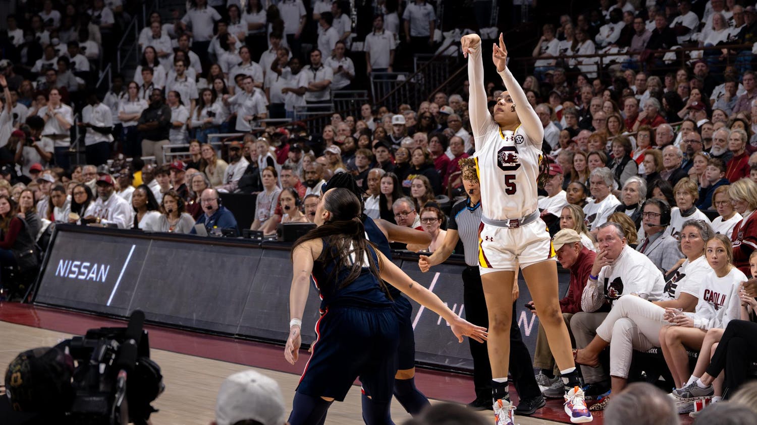 Freshman guard Tessa Johnson attempts a 3-point shot during the Gamecocks' 83-65 victory over the Huskies on Feb. 11, 2024. Johnson scored 9 points for the Gamecocks during her 15 minutes playing at Colonial Life Arena.