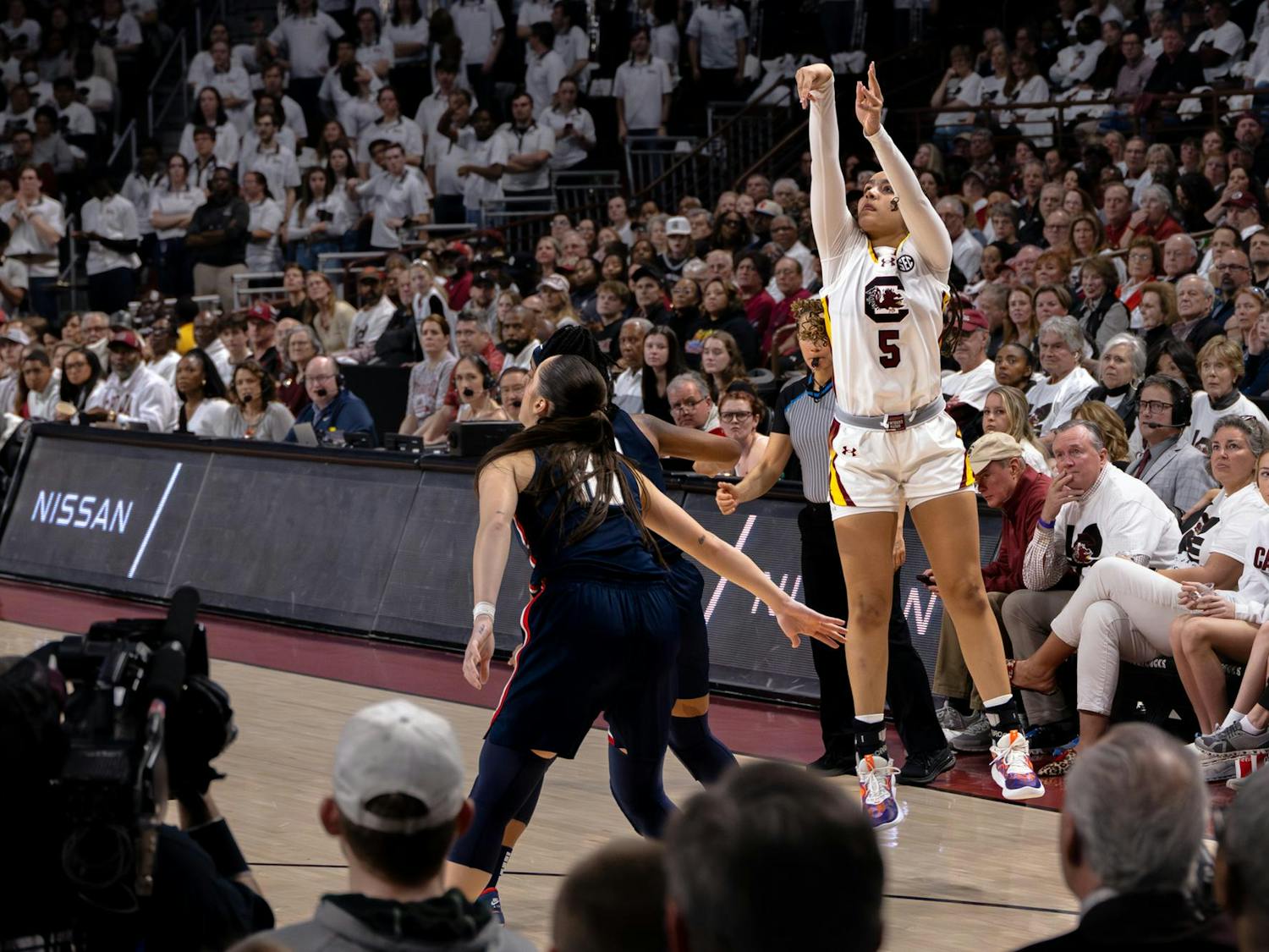 Freshman guard Tessa Johnson attempts a 3-point shot during the Gamecocks' 83-65 victory over the Huskies on Feb. 11, 2024. Johnson scored 9 points for the Gamecocks during her 15 minutes playing at Colonial Life Arena.