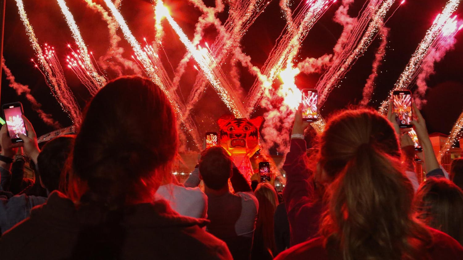 University of South Carolina students watch and record the wooden tiger go up in flames at the annual Tiger Burn celebration. The burning tiger was accompanied by fireworks and other festivities on Nov. 20, 2023.