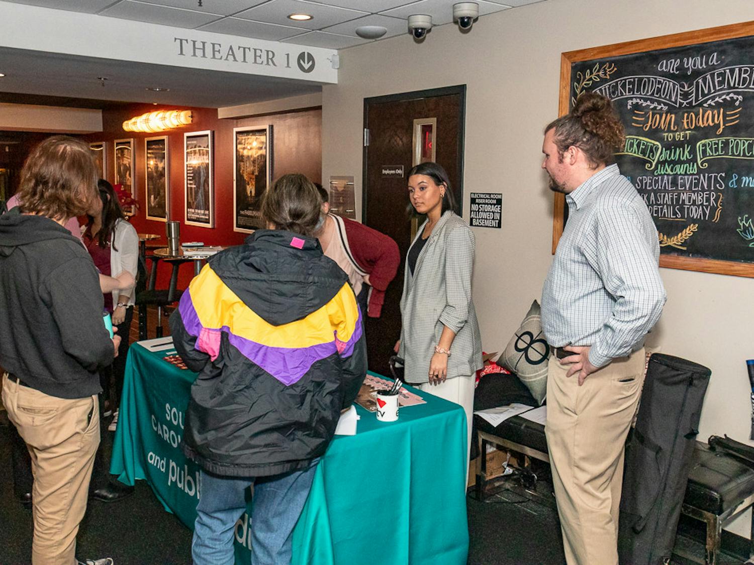 Members of SC Educational Television hand out information about Narcan Community Distributors, Narcan, and other useful information after the showing of "Love in the Time of Fentanyl" at the Nickelodeon Theater on Jan. 25, 2023. SC ETV teamed up with PBS to show this episode of their docu-series "Indie Lens Pop-Up." "Love in the Time of Fentanyl" officially premiered on Feb. 13, 2023.