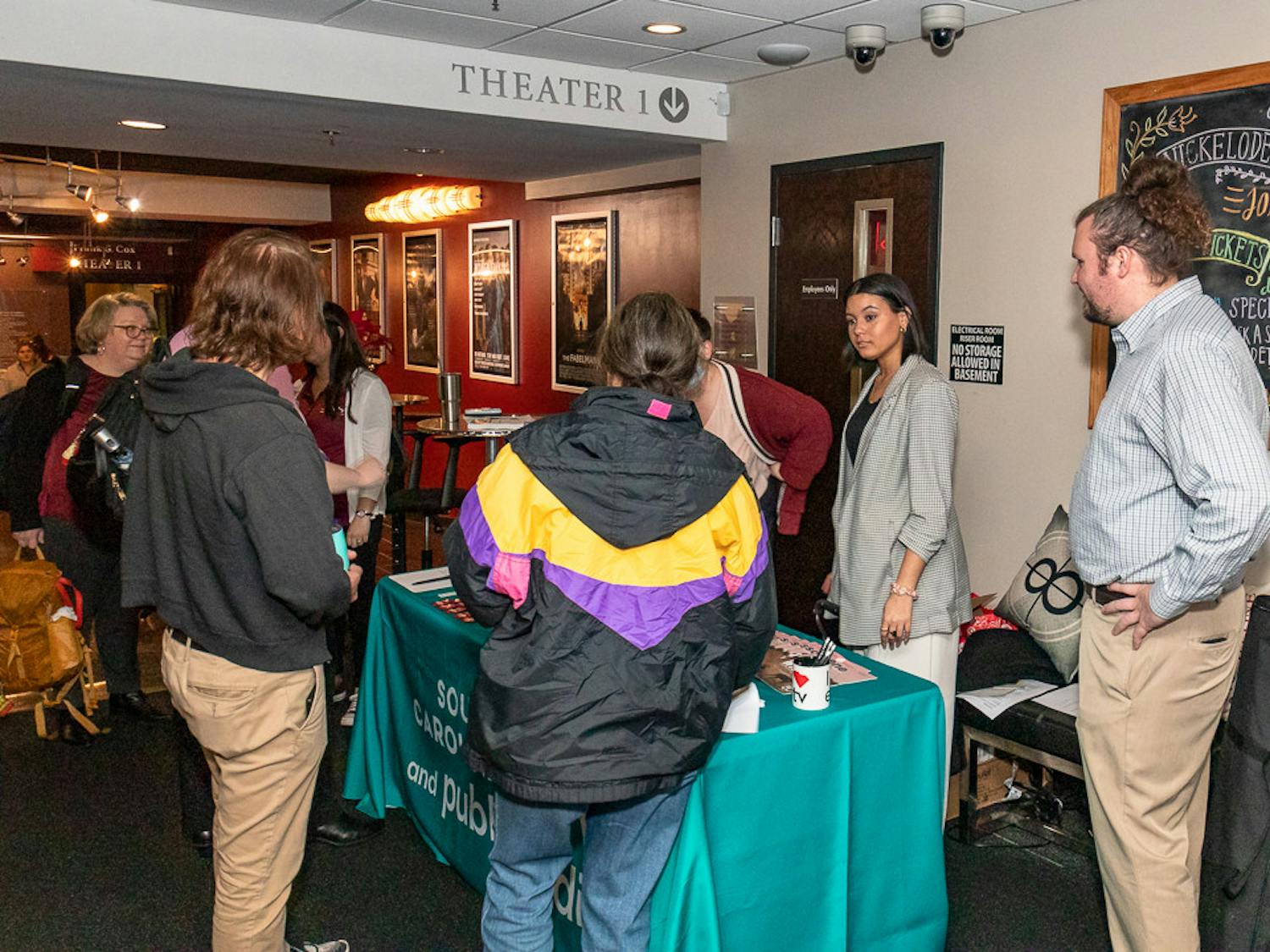 Members of SC Educational Television hand out information about Narcan Community Distributors, Narcan, and other useful information after the showing of "Love in the Time of Fentanyl" at the Nickelodeon Theater on Jan. 25, 2023. SC ETV teamed up with PBS to show this episode of their docu-series "Indie Lens Pop-Up." "Love in the Time of Fentanyl" officially premiered on Feb. 13, 2023.