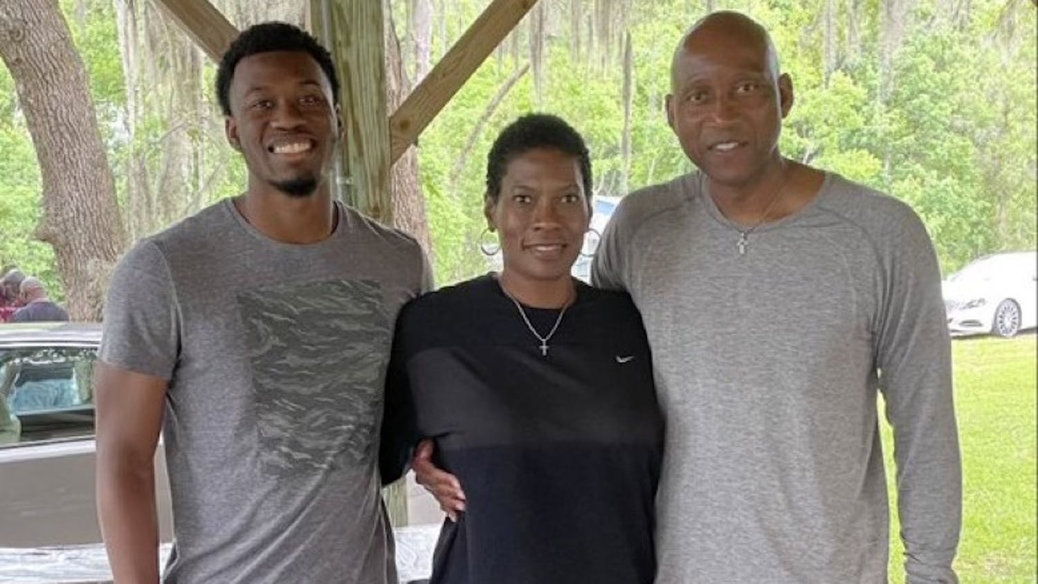 USC Upstate men's basketball head coach Dave Dickerson Jr. poses with his son and his wife. 