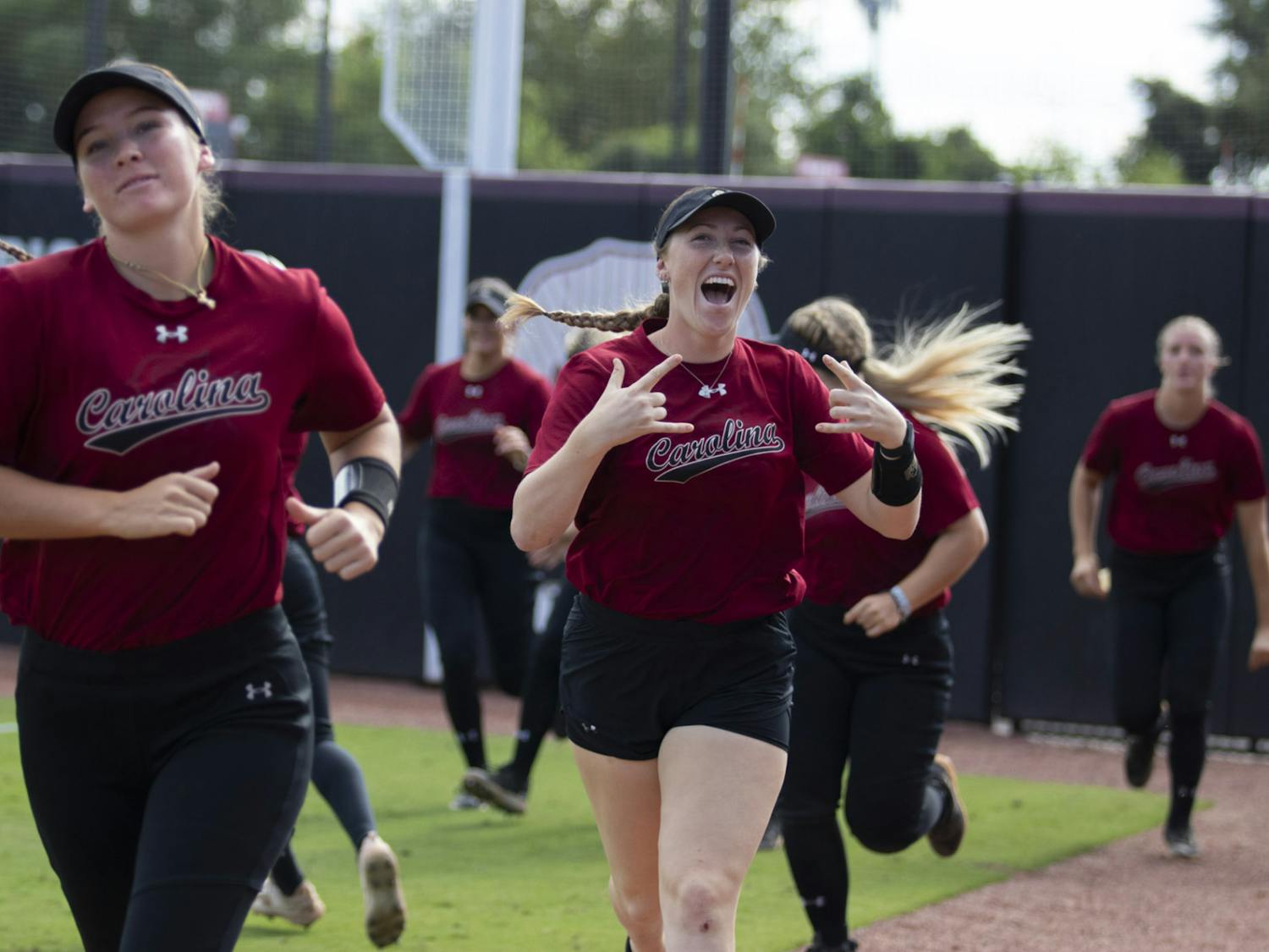 South Carolina softball players jog out to the field for a doubleheader on Oct. 7, 2023.&nbsp;The Gamecocks took down Wofford and USC Beaufort as part of a seven-game fall exhibition schedule.