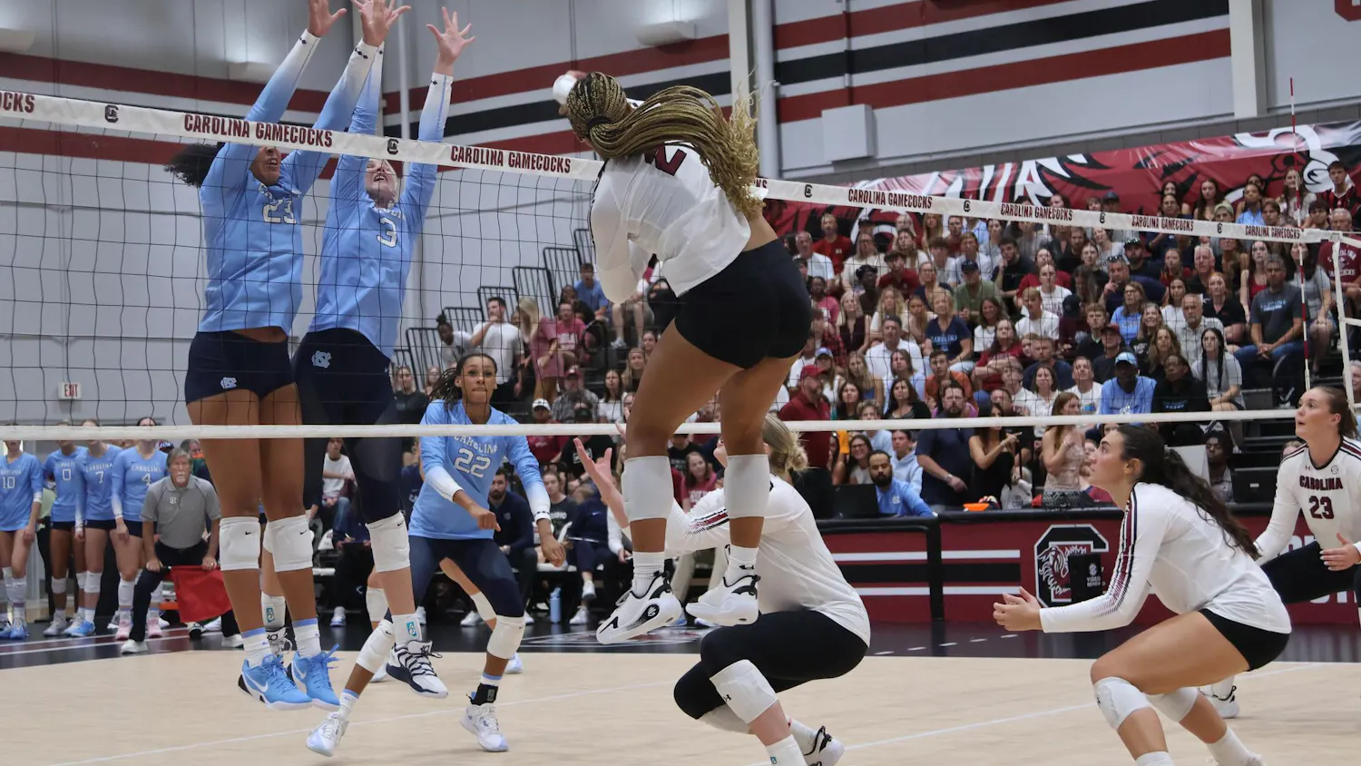 Freshman outside hitter Victoria Hill hits the ball around the block during the game against North Carolina on Sept. 12. Hill racked up the second most kills for the Gamecocks with 17.