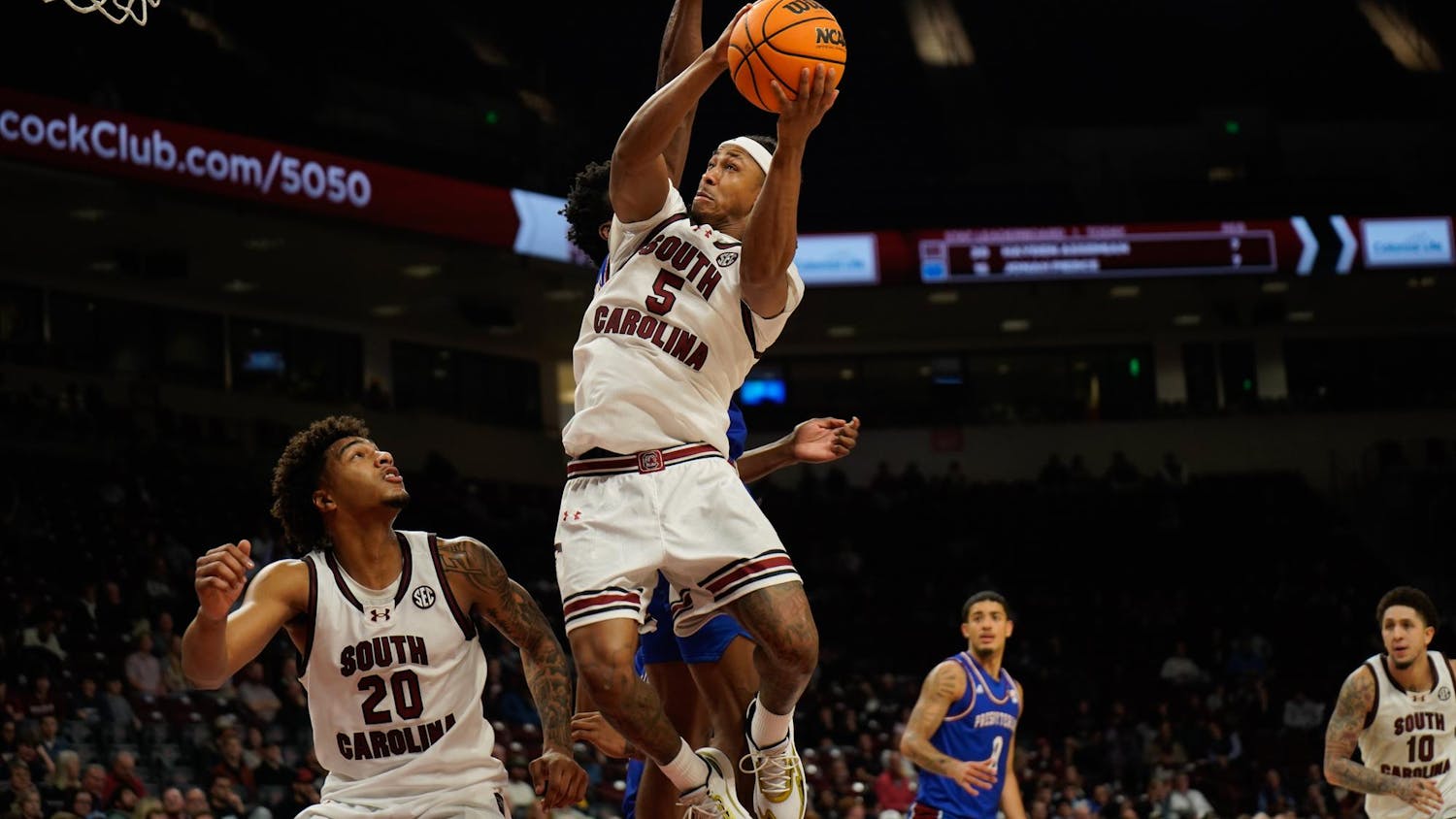 FILE — Redshirt senior guard Meechie Johnson goes up for a layup against a Presbyterian College defender in the Gamecocks' matchup against Presbyterian College at Colonial Life Arena on Nov. 12, 2025. Johnson played a team-high of 25 minutes in this game.