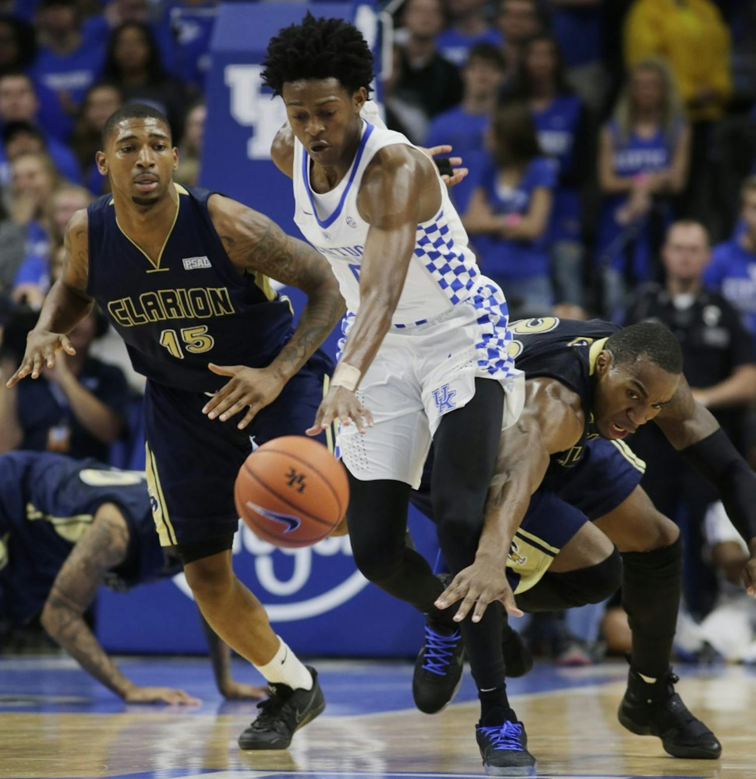 Kentucky Wildcats' De'Aaron Fox (0) outmaneuvers Clarion's Jamani Pierce (15)  and Akeem Williams, right, in the first half on Sunday, Oct. 30, 2016 at Rupp Arena in Lexington, Ky. (Pablo Alcala/Lexington Herald-Leader/TNS)