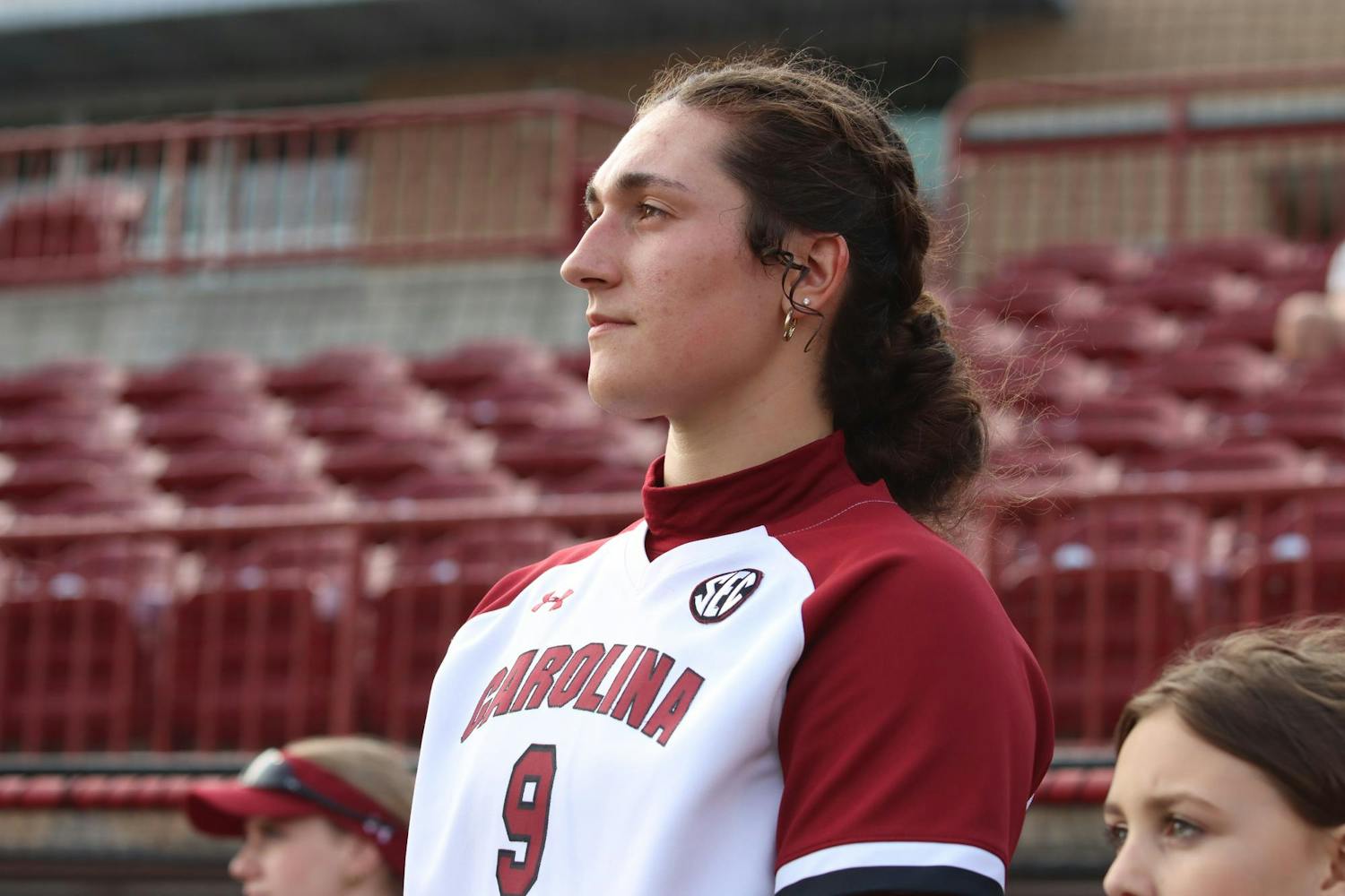 FILE - Freshman two-way player Reganne Bennett stands for the national anthem before the game against the College of Charleston on Feb. 28, 2024. During this game, Bennett pitched three innings and allowed no runners to score.