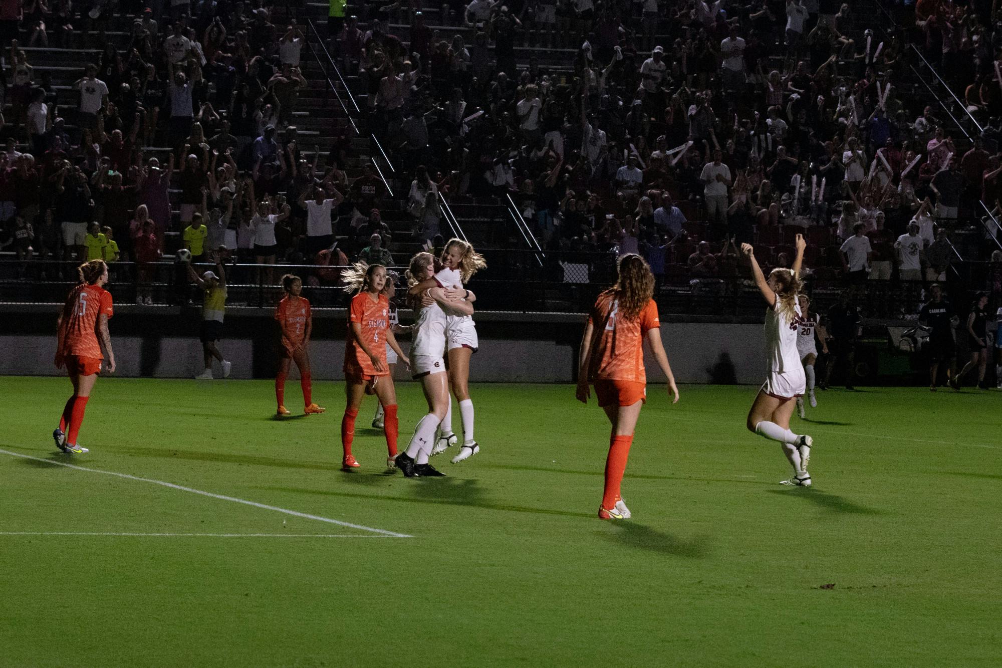Freshman Shay Montgomery runs into the arms of Abby Hugo who just scored, tying the game as other teammates begin to celebrate in the second half on Thursday, Sept. 1, 2022. The lady Gamecock’s ended their game against Clemson with a score of 2-2, tying the game with the Tigers.