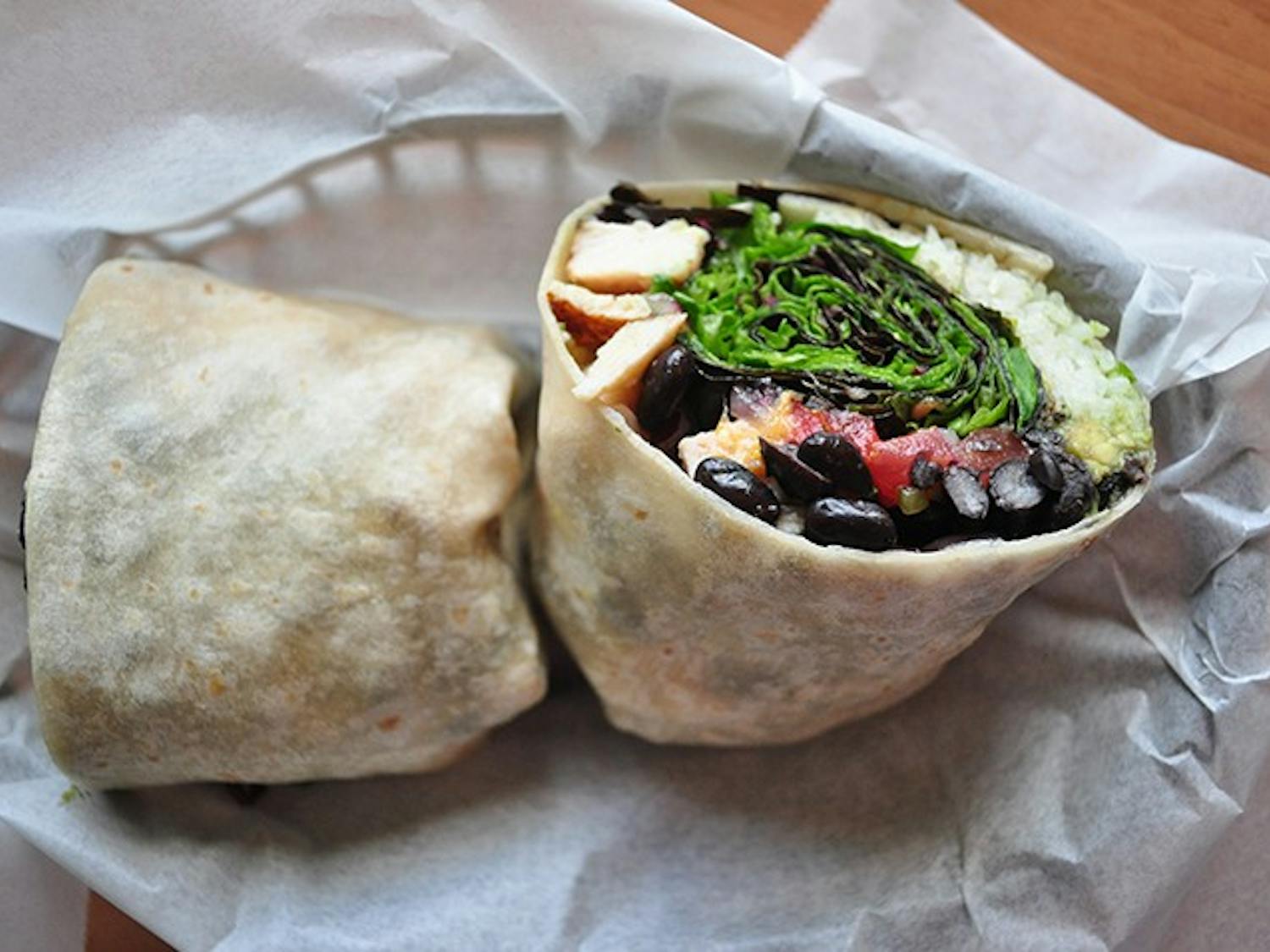 Beach BurritoIngredients: Roasted chicken breast, black beans, rice, sprouts, fresh guacamole, mango salsa and mixed greens