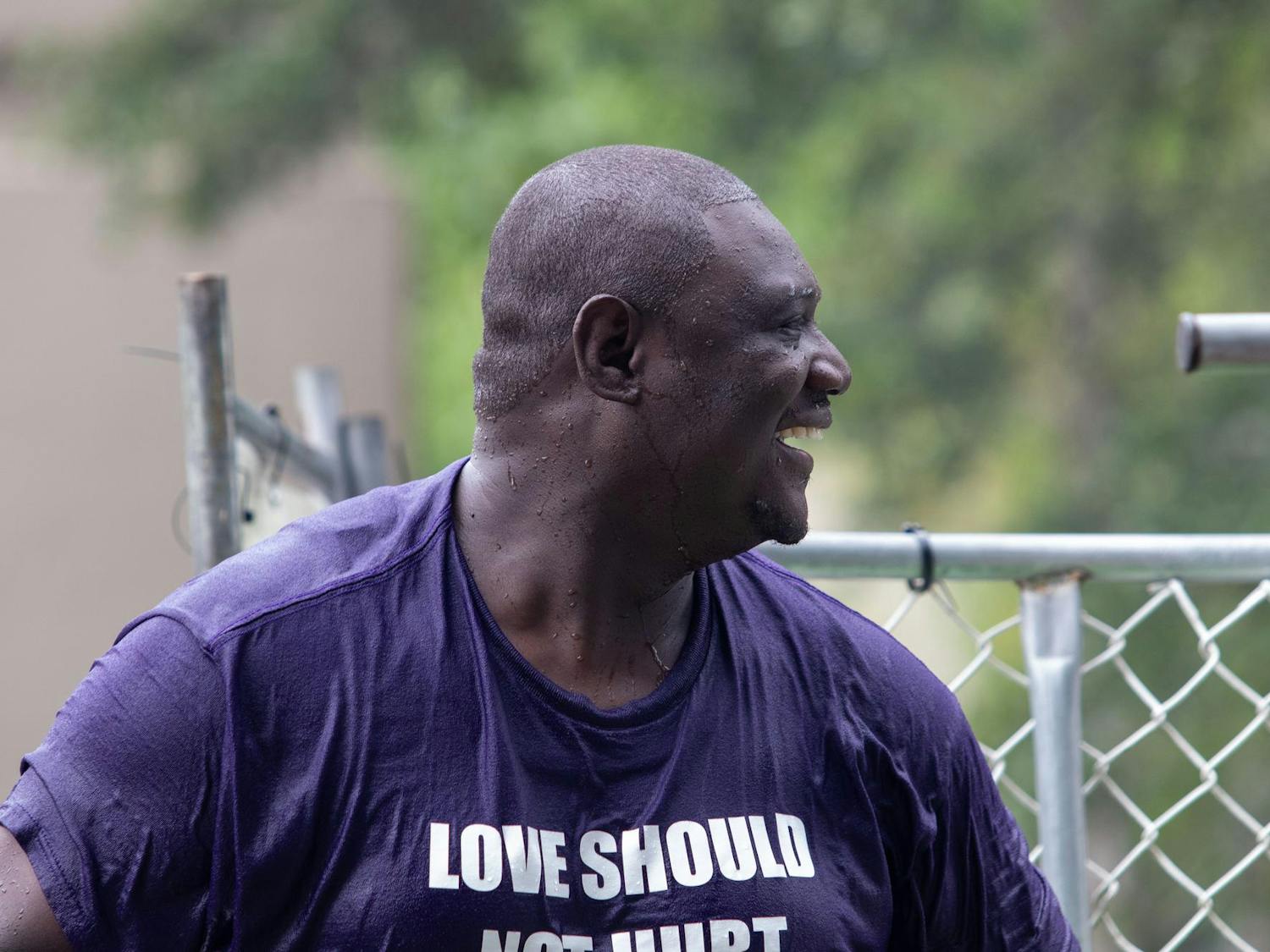 Trevon Fordham, the City of Columbia's Director of Violent Crime Prevention, smiles at the crowd while sitting in the dunking booth at Soda City Market on July 27, 2024. Fordham, who was appointed to the city's newly created Office of Violent Crime Prevention, started in June.
