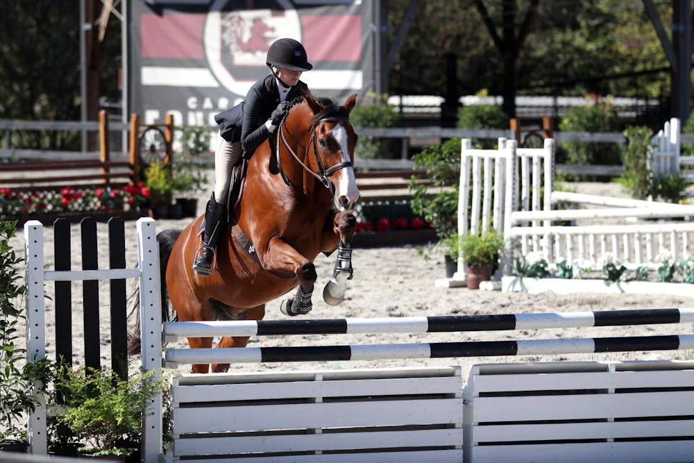 <p>Flat and fences junior Grace Rabb jumps Nino in the second half of the fences division against Texas A&amp;M at One Wood Farm on Oct. 17, 2025. Rabb scored a 93 with her round, earning the Gamecocks a point.</p>