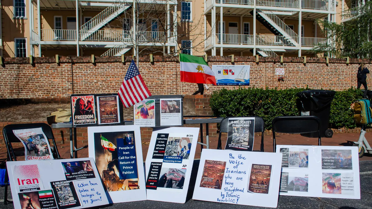 A demonstration in support of protestors in Iran takes place outside the Russell House on Greene Street in Columbia, South Carolina, on Jan. 15, 2026. Signs accuse the Islamic Republic of genocide and support the return of Crown Prince Reza Pahlavi, who is in exile in the United States.