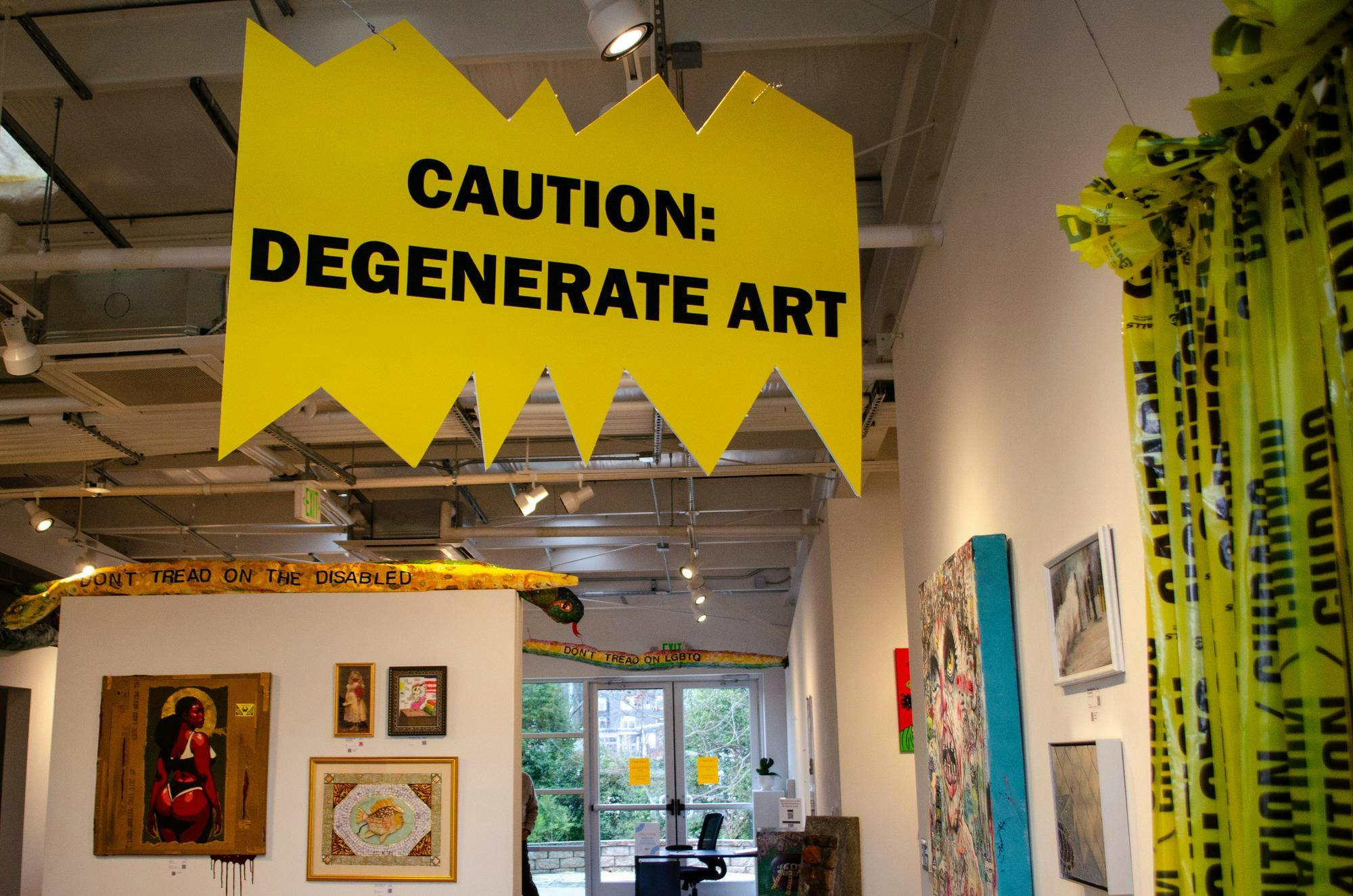 A sign warns entrants of the “Degenerate” art ahead in Stormwater Studios at 413 Pendleton St., Columbia, South Carolina, Feb. 25, 2026. The Degenerate Art Project II is the second exhibition from the Jasper Project that echoes a 1937 art exhibition organized by Nazi Germany to mock modern art.
