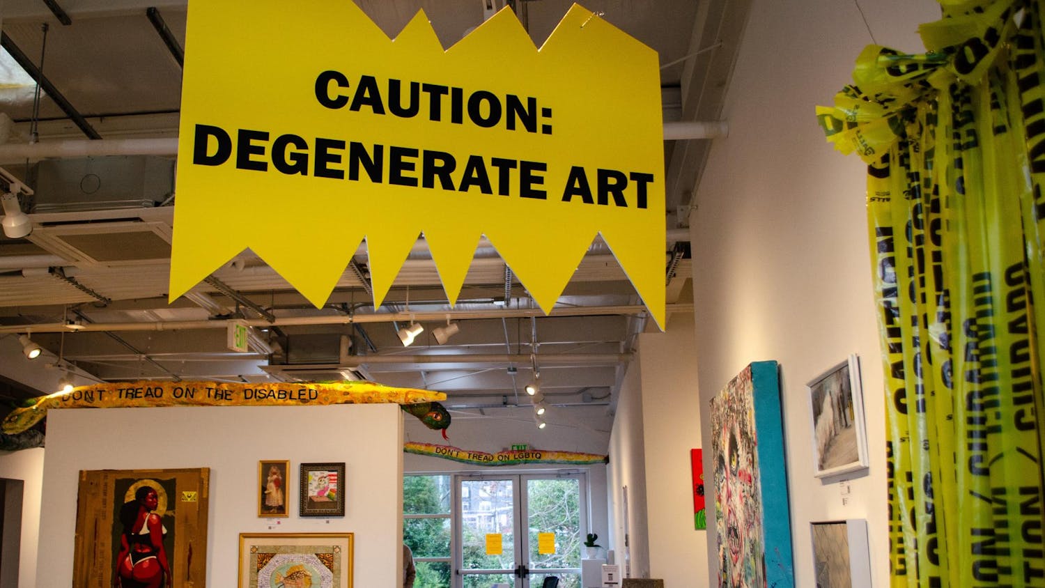 A sign warns entrants of the “Degenerate” art ahead in Stormwater Studios at 413 Pendleton St., Columbia, South Carolina, Feb. 25, 2026. The Degenerate Art Project II is the second exhibition from the Jasper Project that echoes a 1937 art exhibition organized by Nazi Germany to mock modern art.