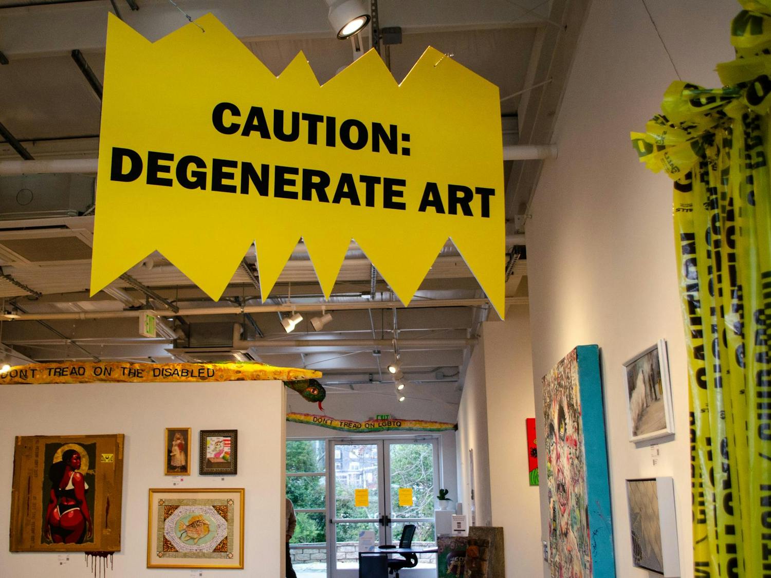 A sign warns entrants of the “Degenerate” art ahead in Stormwater Studios at 413 Pendleton St., Columbia, South Carolina, Feb. 25, 2026. The Degenerate Art Project II is the second exhibition from the Jasper Project that echoes a 1937 art exhibition organized by Nazi Germany to mock modern art.