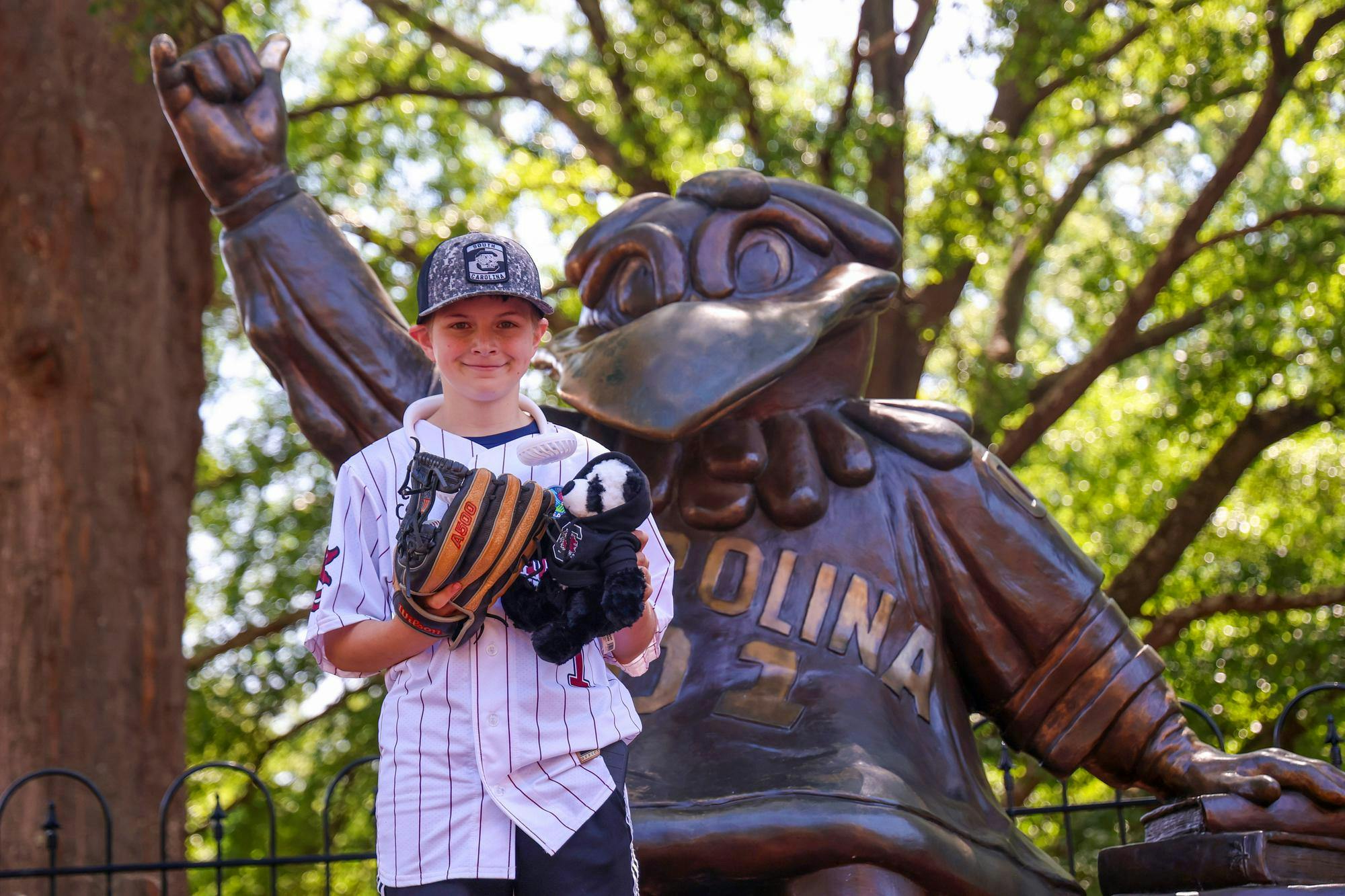 Lexington resident Gabriel Lyons poses in front of the Cocky Statue on April 25, 2026. Lyons went from campus to Founders Park, where he would throw out the ceremonial first pitch.