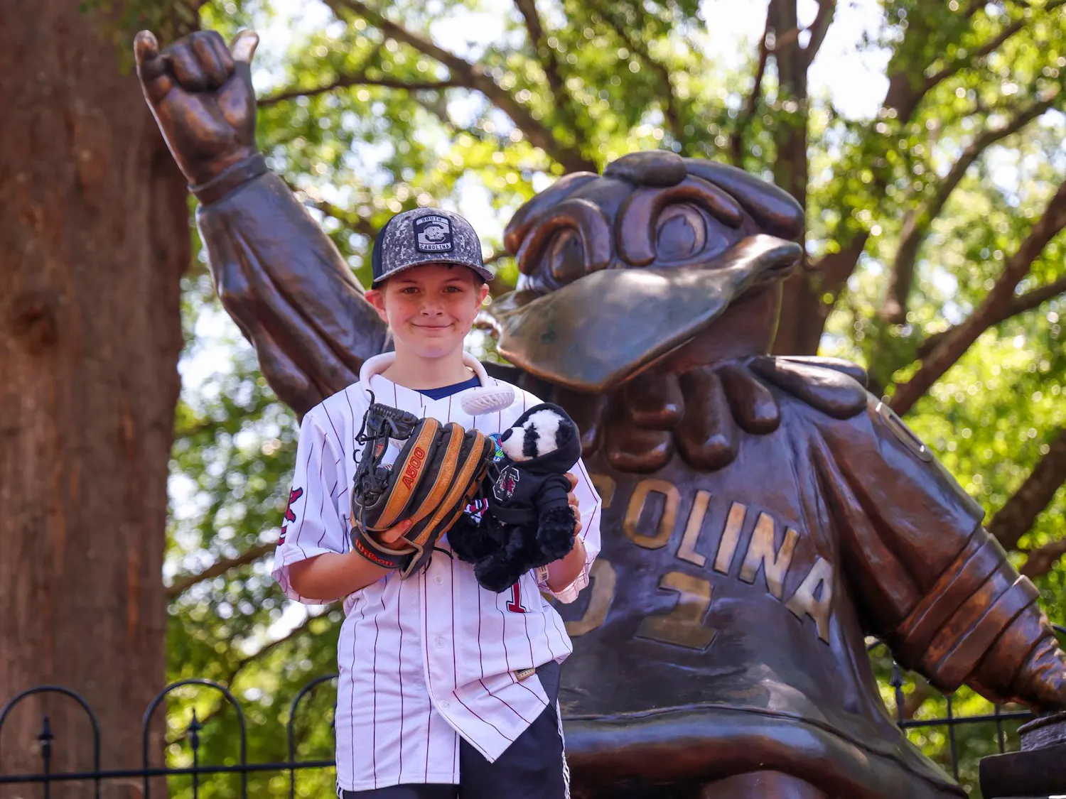 Lexington resident Gabriel Lyons poses in front of the Cocky Statue on April 25, 2026. Lyons went from campus to Founders Park, where he would throw out the ceremonial first pitch.