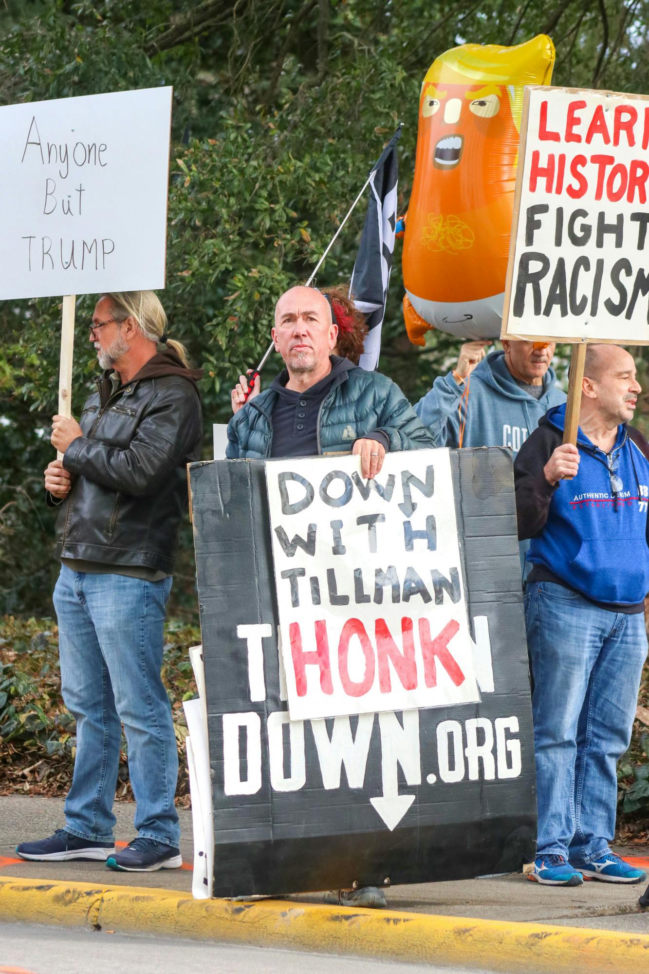 A mix of Ben Tillman statue protestors and anti-Trump protestors gathered on the sidewalk outside the South Carolina Statehouse on Jan. 28, 2023. "I would like to see (Ben Tillman's statue) melted down and made into a urinal, so I could properly express how I feel about this man as a former governor of South Carolina," Andy Lopez (right) said on behalf of the group.&nbsp;