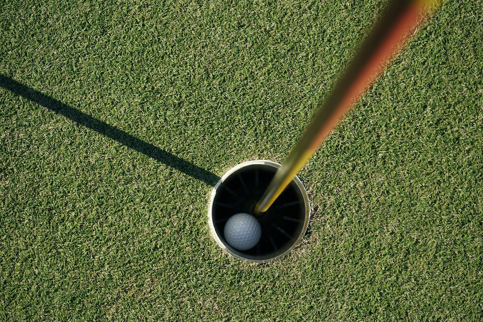 A picture of a golf ball in a hole on a golf course. (Dreamstime/TNS)