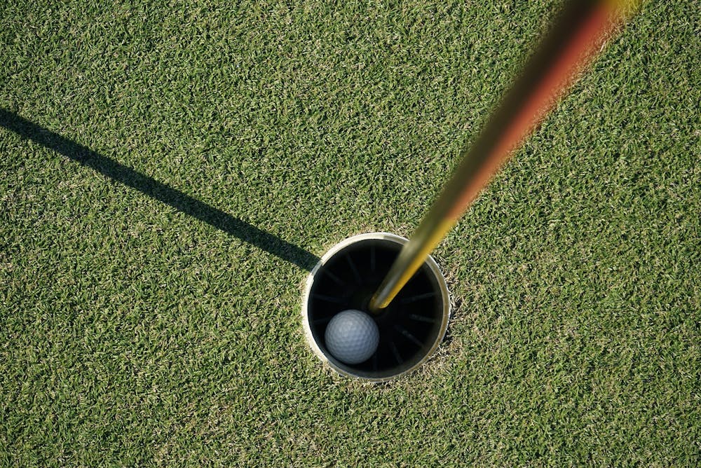 <p>A picture of a golf ball in a hole on a golf course. (Dreamstime/TNS)</p>