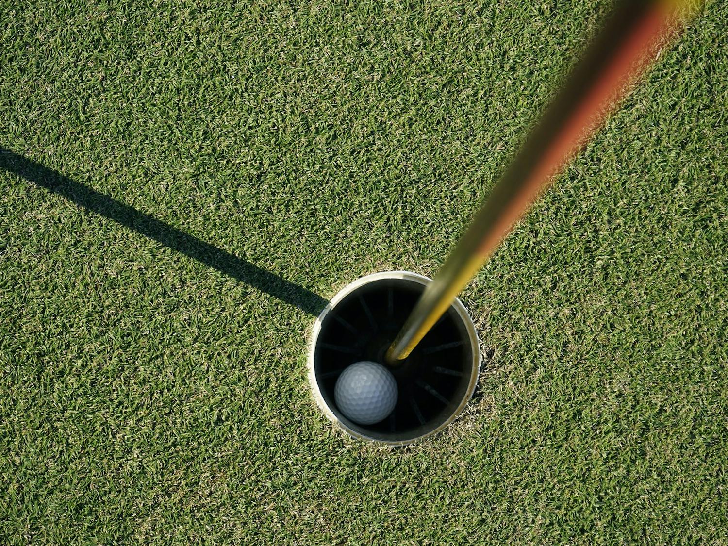 A picture of a golf ball in a hole on a golf course. (Dreamstime/TNS)