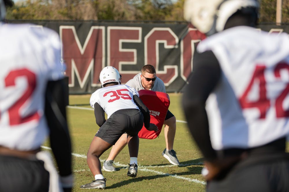 <p>FILE— The SC football team goes over defensive drills during a spring practice on Tuesday, March 15, 2022. &nbsp;</p>