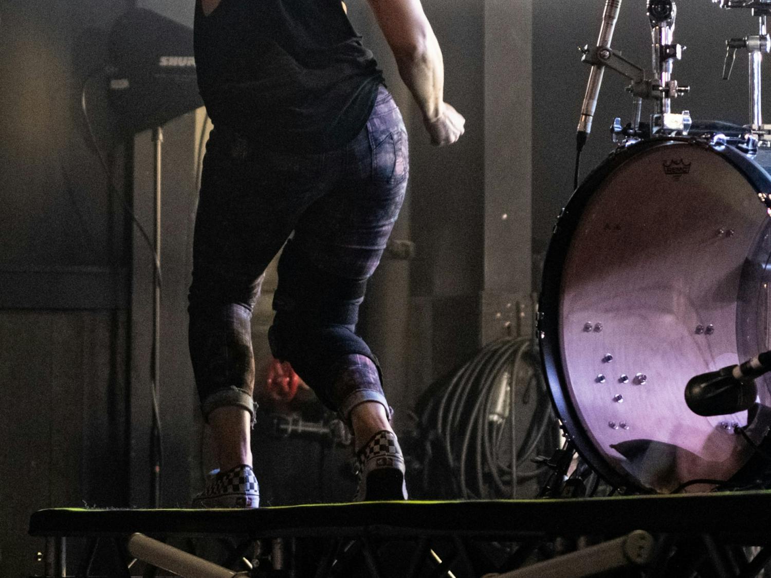 Kim Schifino dances between songs at their concert Nov. 17, 2019. Despite wearing a knee brace from a previous injury during shows, Schifino was very active on stage.
